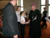Ola odbiera gratulacje z rąk Ks. Biskupa Jana